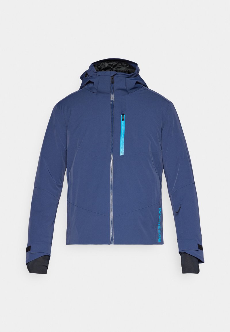Veste bleu marine avec fermeture éclair à l'avant, capuche ajustable et accents turquoise contrastés. Comprend des poignets élastiques et une poche sur la poitrine.