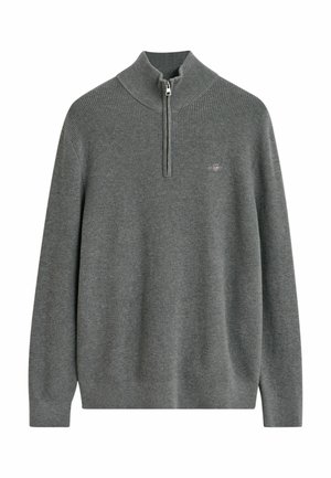 Pullover grigio a coste con maniche lunghe e collo alto con zip a metà, caratterizzato da un piccolo logo a scudo ricamato sul petto.