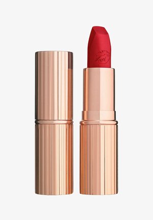 Red lipstick with embossed lip print on bullet, housed in a shiny rose gold metallic tube with cap beside it.