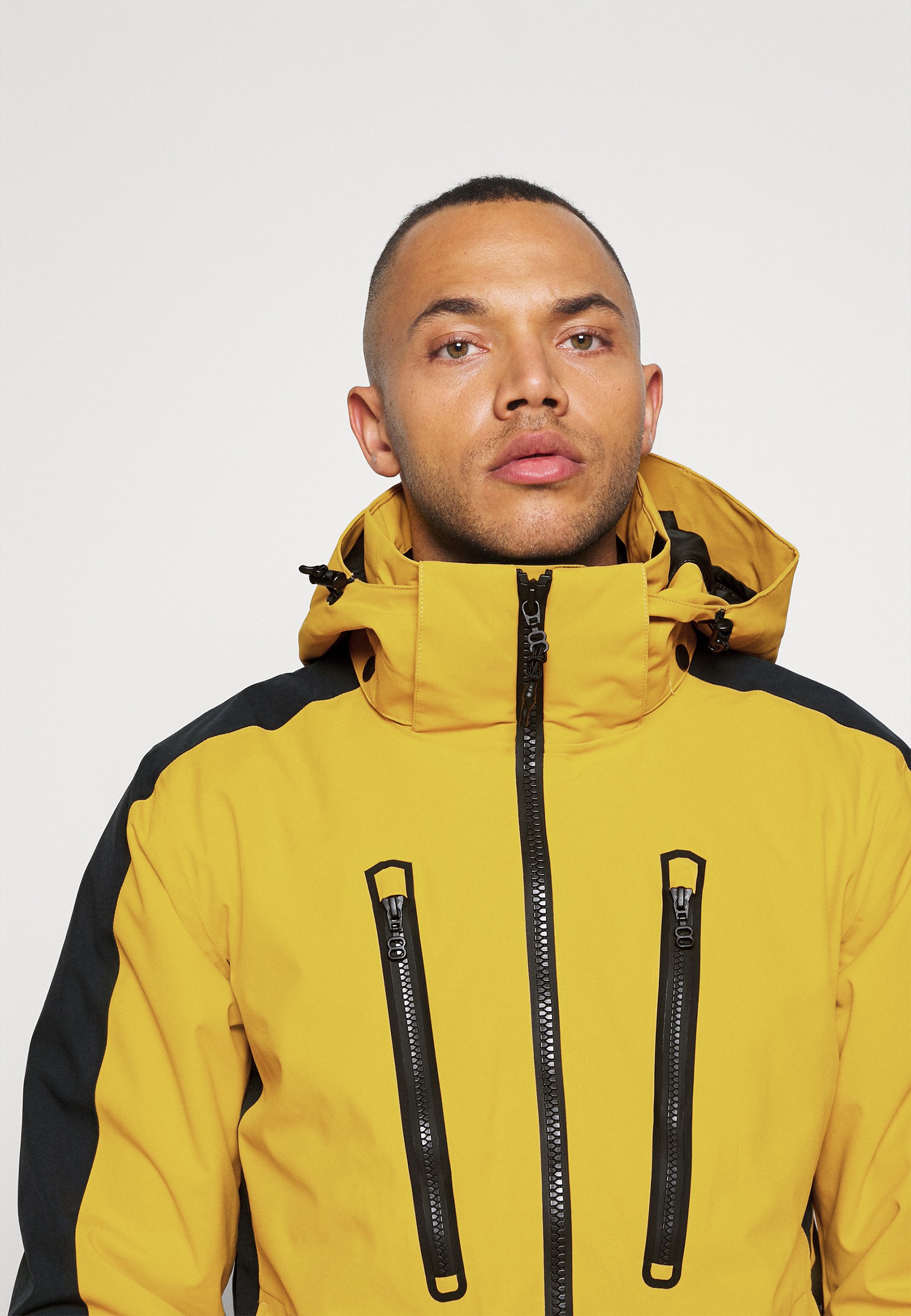mustard yellow ski jacket