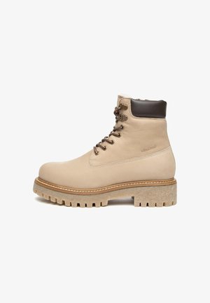 Beige Leder-Ankle Boots mit einem braunen gepolsterten Kragen, Schnürdesign und einer klobigen, strukturierten Gummisohle mit ausgeprägtem Profil.
