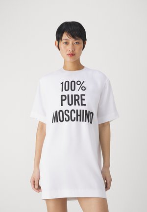 White oversized T-shirt dress with short sleeves, featuring large black text reading "100% PURE MOSCHINO" across the front. Smooth texture.