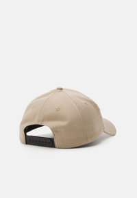 Calvin Klein Jeans MONOLOGO WARM UNISEX - Naģene - savannah tan