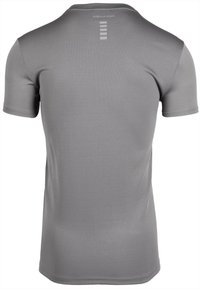 Grijze sportieve T-shirt met korte mouwen en een gestructureerde stof. Beschikt over een subtiele logo op de achterkant en een slim fit ontwerp.