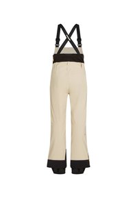 Beige skibroek met verstelbare zwarte bretels, wijde pijpen, versterkte zwarte boorden en ritszakken achteraan.