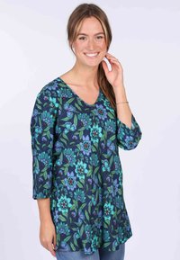 Navy floral tunic with three-quarter sleeves, featuring blue and green flowers, deep V neckline, and a relaxed fit.