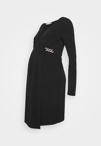 Vestido de maternidade preto com mangas longas, design em v, cintura franzida e um detalhe trançado na lateral. Tecido suave e elástico.