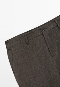 Dark brown, textured fabric pants with a flat front, belt loops, and a single button closure. Features side pockets and a tailored fit.