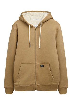 Sweat à capuche beige zippé avec cordons blancs, poches avant kangourou et doublure intérieure en polaire crème douce dans la capuche.