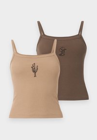 To ribbede topper i beige og brun, med broderte design: en kaktus på den beige toppen og en figur med hatt på den brune toppen.