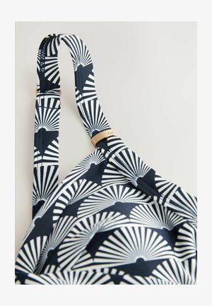 Marine bikini top med et hvidt vifte mønster, justerbare stropper og et accent i guld-tone hardware. Blødt stof med glat tekstur.