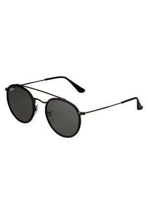 Round black sunglasses with metal frame, dark lenses, thin temples, and clear nose pads. No visible logos or decorative accents.