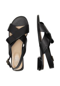 Zwarte leren dames sandalen met gekruiste banden, een slingbackgesp, beige inlegzool en lage vierkante hak, weergegeven vanuit boven- en zijzicht.