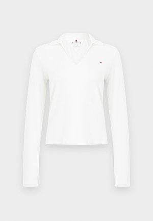 White long-sleeve polo shirt with a V-neck, featuring a classic collar. Small logo on the left chest; smooth, lightweight fabric.