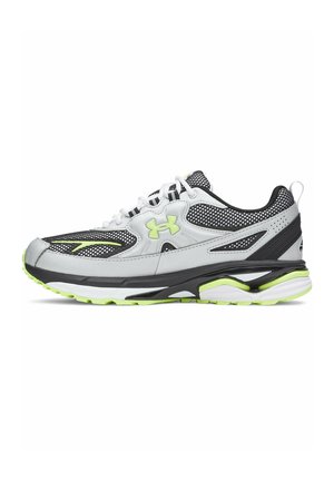 Running shoe with white, black, and neon green design, mesh upper, cushioned sole, and Under Armour logo on the side.
