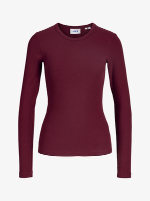 Maglia a maniche lunghe, con costine, di un profondo colore bordeaux. Presenta un colletto rotondo e un design aderente. Realizzata in materiale morbido e elasticizzato.