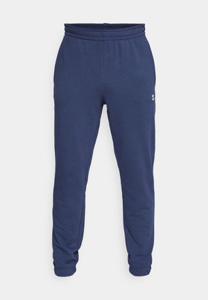 Navy blue sweatpants with elastic waistband and cuffs, made of soft fabric. Features a small logo detail on the side.
