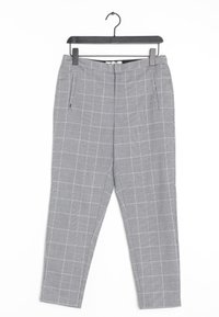 Pantalons à carreaux gris avec une coupe slim, dotés d'un devant plat, de poches latérales et d'un zip. Fabriqués dans un tissu texturé.