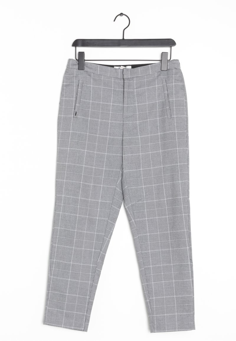 Pantalons à carreaux gris avec une coupe slim, dotés d'un devant plat, de poches latérales et d'un zip. Fabriqués dans un tissu texturé.