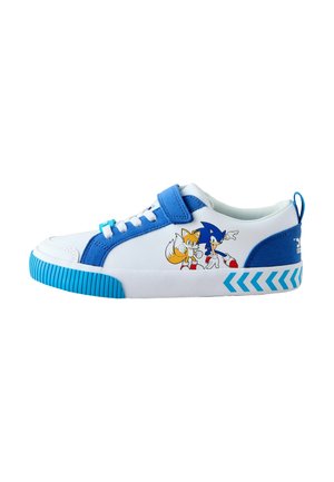 White sneaker with blue accents, featuring characters Sonic and Tails printed on the side. Textured rubber sole with zigzag pattern. Velcro strap.
