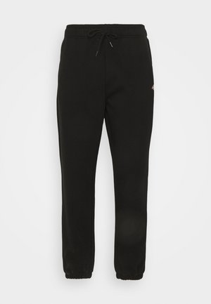 Pantalon de survêtement noir fuselé avec taille élastique, cordon et poignets élastiques, avec un petit logo sur la hanche droite.