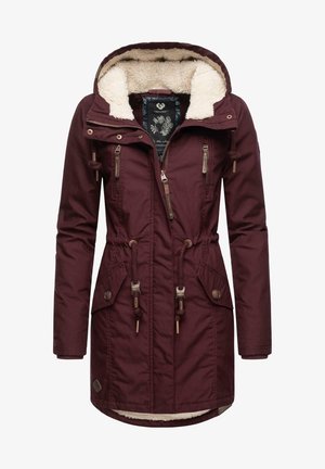 Bordo parka plašč z obloženim kapuco iz flisa, z zapiranjem na zadrgo, z vrvico v pasu in žepi na gumbke. Teksturovan material z rjavimi detajli.