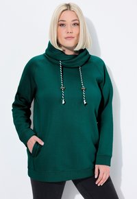 Felpa verde con colletto a cowl, lacci e tasche. Realizzata in un materiale morbido con una vestibilità comoda e dettagli di cucitura laterale sottili.