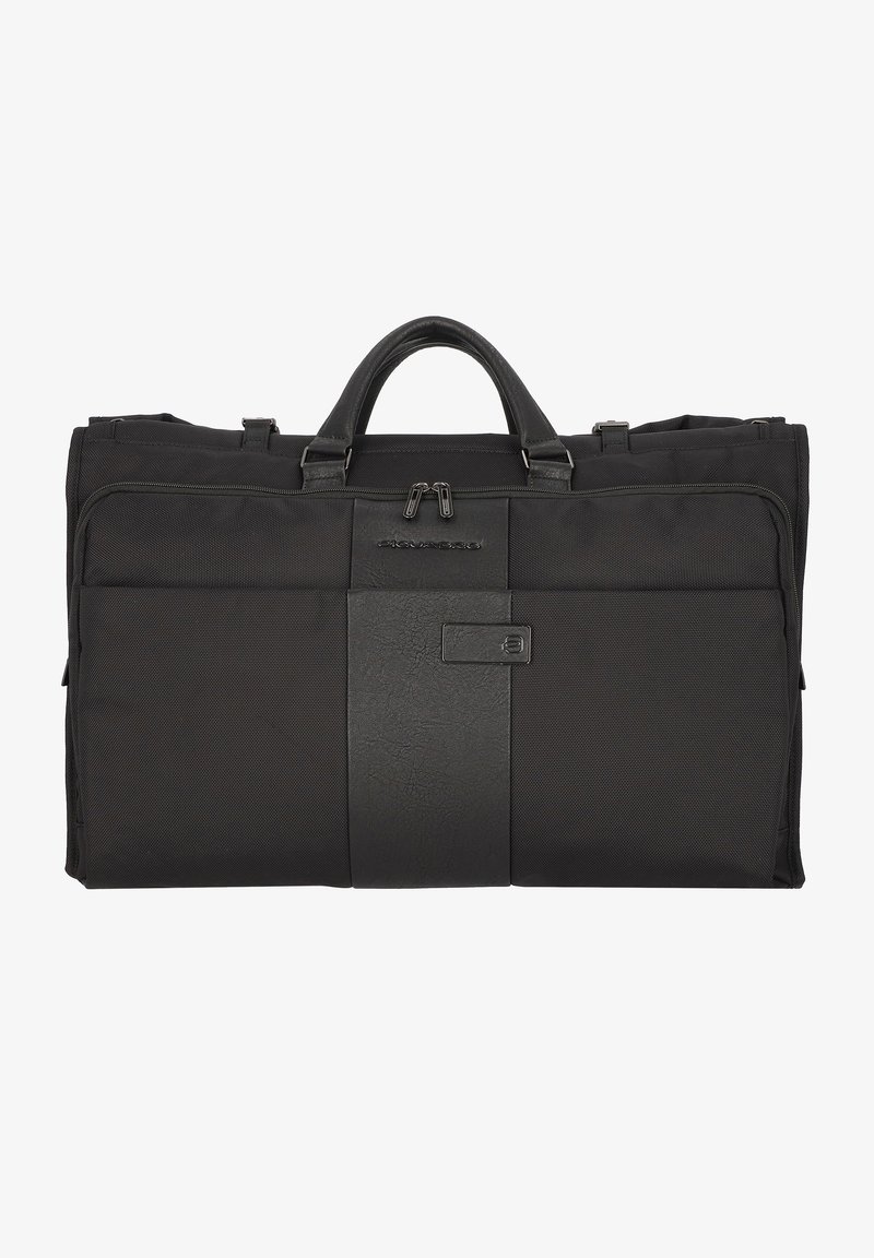 Schwarze Reisetasche aus strapazierfähigem Stoff mit glattem Lederakzent. Verfügt über zwei Griffe und eine vordere Reißverschlusstasche zur Aufbewahrung.
