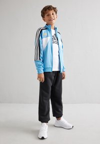 adidas Performance TIRO NATIONS PACK UNISEX - Treniņjaka - light blue/white/black/hazy beige