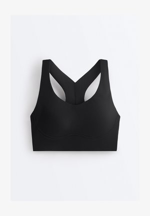 Črni športni modrček brez šivov s širokimi naramnicami in zadnjim delom v obliki dirkaškega hrbta, izdelan iz gladkega, raztegljivega materiala za podporo in udobje.