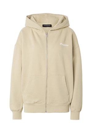 Felpa beige con zip, tasche frontali, polsini e orlo a costine, cappuccio e logo "Pegador" sul petto a sinistra.