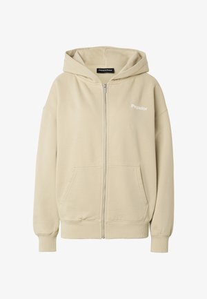 Bež kapucar z zadrgo, sprednjimi žepi, rebrastimi manšetami in robom, kapuco ter logotipom "Pegador" na levi strani prsnega koša.