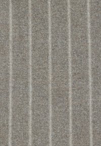 Textured fabric in light grey with subtle beige stripes, featuring a woven appearance and a soft, durable texture.