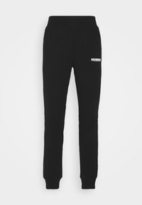 Zwarte slim-fit joggingbroek met elastische tailleband en boorden, met wit "HUMMEL"-logo op de bovenkant van de linker dij.