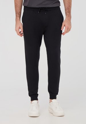 - Spodnie treningowe