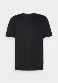 Črna majica s kratkimi rokavi iz mehke tkanine. Ima majhen, toniran logotipni znak na prsih in klasičen krožni izrez.