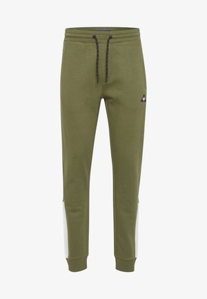 Pantaloni della tuta verde oliva realizzati in misto cotone, con vestibilità affusolata, cintura elastica, cordoncino e pannelli laterali bianchi a contrasto.
