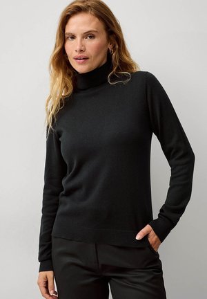 Maglione a collo alto nero realizzato in un materiale morbido e lavorato a maglia. Presenta maniche lunghe e polsini e orlo a coste. Design semplice e classico.