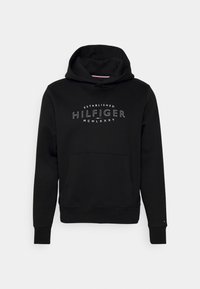 Felpa nera in cotone con tasca a marsupio, polsini a coste e logo in testo bianco sulla parte anteriore con la scritta "HILFIGER" e la data di fondazione.