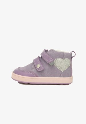 Purple suede ankle boot featuring two adjustable Velcro straps, a silver heart accent, and a pink rubber sole with textured grip.
