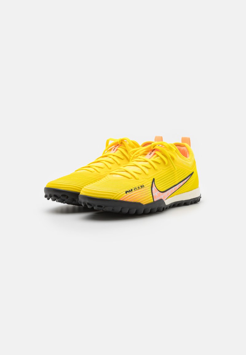 yellow nike astro turf