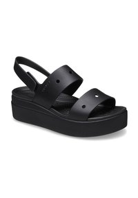 Schwarze Plattformsandalen mit zwei breiten Riemen mit runden Ausschnitten, einer gepolsterten Fußbett und einem Slingback-Design.