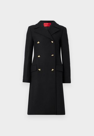 Schwarzer knielanger doppelt gebreiteter Mantel mit goldenen Knöpfen, breiten Revers und Klapptaschen, auf einem weißen Hintergrund präsentiert.