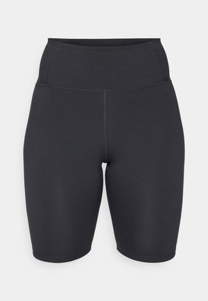 Augstās vidukļa melnas velosipēdu šorti, izgatavoti no gludas, elastīgas auduma; tiem ir plakana šuvju konstrukcija un pieguļoša forma komfortam un atbalstam.