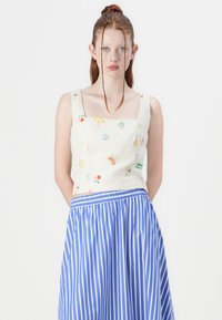 Jupe portefeuille asymétrique pour femme avec poignets de jambe - Mini