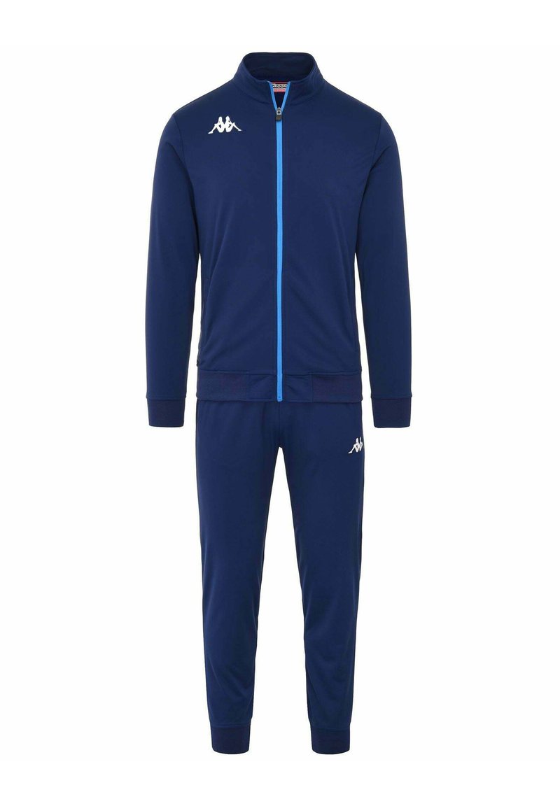Tuta sportivo blu navy realizzata in tessuto liscio, con giacca zip-up con dettagli blu e pantaloni affusolati abbinati. Logo Kappa su entrambi i capi.