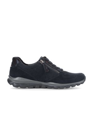 Black suede sneaker with side zipper and laces, cushioned sole, and textured tread, shown from the outer side on a white background.