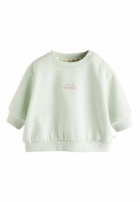 Lys grøn, kortærmet sweatshirt med ribbede mansjetter og talje. Har broderet tekst i lyserød og trykknapper ved skulderen.