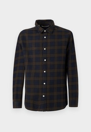 Tumedate varrukad, tumesinine särk pruunide ruuduliste mustritega. Valmistatud pehmest kangast, esiküljel nööpide kinnitamine ning klassikaline krae.