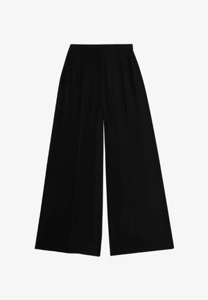 Pantalons larges noirs avec une taille haute, fabriqués dans un tissu lisse, dotés de plis pressés pour la structure et une coupe ajustée.